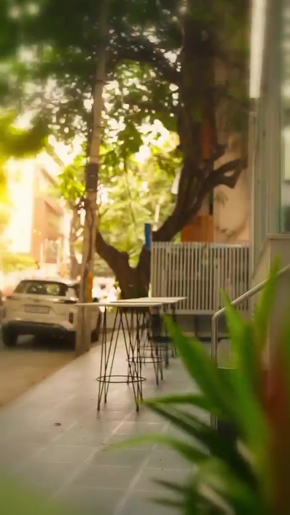Outdoor seating under the trees at Sri Ram Cafe on 17th A Main Road, Koramangala